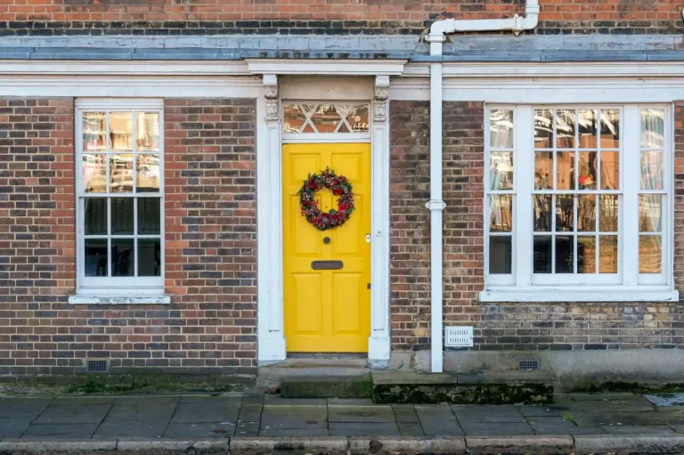 Types of door locks in the UK – yellow front door on a red-brick Victorian house in Sheffield, Locksmith Sheffield guide to identifying your lock